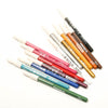 A row of colourful make up pencils for kids, by Namaki
