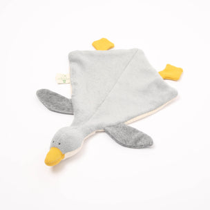 Gray goose-shaped soft toy with yellow beak and feet on a white background