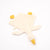 Plush toy shaped like a duck with a yellow beak on a white background