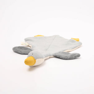 Plush toy shaped like a turtle with a yellow mouth on a white background