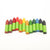Set of colorful crayons with green bases on a white background