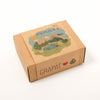 Cardboard box with scenic design and 'GRAPAT' branding on a white background