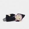 Toy figure of a character with a black outfit and pink hair on a white background