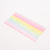 Rectangular wax sheet with pastel rainbow stripes on a white background