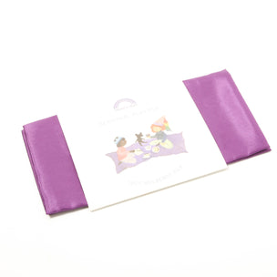 Purple fabric with a floral design on a white background