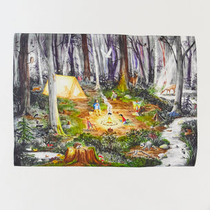 A rectangular art print or poster depicting a whimsical forest camping scene with a yellow tent, people around a campfire, deer, trees, and a stream, shown against a plain light background.