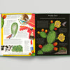 Open book with illustrations of a prickly pear cactus and related images on a gray background
