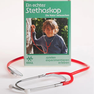 Stethoscope with a child playing outdoors on the packaging, on a white background