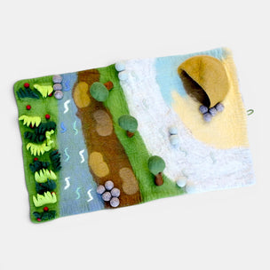 Two felted landscape patches on a white background