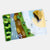 Two felted landscape patches on a white background