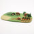 Felt playset with hedgehogs, rabbits, and vegetables on a green base.
