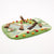 Felted play mat with animal figures on a white background