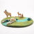 Felted play mat with animal figures on a white background