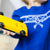 Child playing with Doc Ryder Yellow & Black Wooden Car | Conscious Craft