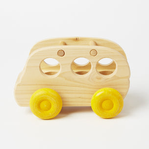 Grimm's wooden bus - takes up to 3 peg dolls on a drive