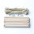All the pieces to assemble a 5 rung Rope Ladder, showing the 2 pieces of 4 metre rope and clips to hang it. Sturdy Outdoor Wooden Toy | Conscious Craft