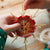 Child making 8 pointed straw star using this simple kit