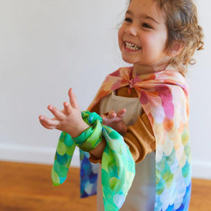 Child with hand dyed play silks, rainbow phoenix and dragon | Conscious Craft