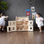 Plan Toys Victorian Doll House with children playing | Conscious Craft