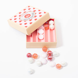 Box of 28 lovely marbles in pink white red from Billes & Co