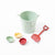 Maileg beach bucket set made up of a blue bucket, red spade and three, red blue and yellow, shell sand moulds | © Conscious Craft