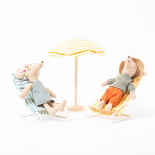 Maileg yellow and white stripe beach umbrella on wooden stand next to two mice on loungers | © Conscious Craft