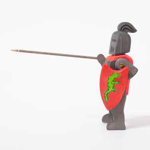 Black knight with green dragon on red shield | © Conscious Craft