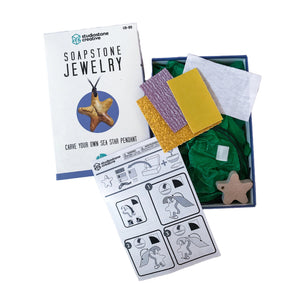 image showing the product box contents featuring: sanding and sculpting tools, wax sea star pendant, a leather necklace cord and an instruction manual